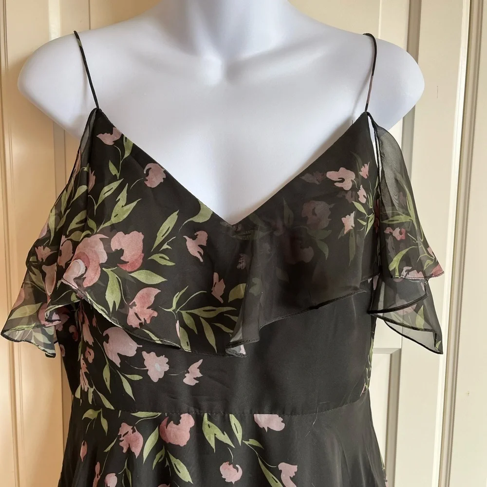 Jenny Yoo Cassie
Flutter Sleeve
Surplice Gown
Black with Floral Pattern. - Picture 15 of 16